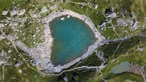 Aerial view of a small lake in the mountains of Stechelberg, Switzerland photo