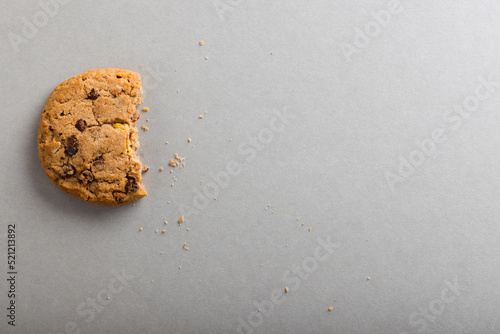 Directly above shot of half eaten cookie on gray background with copy space