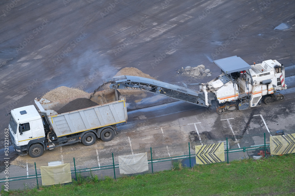 Road Removal Milling Machine Loads Recycled Asphalt To Truck Asphalt