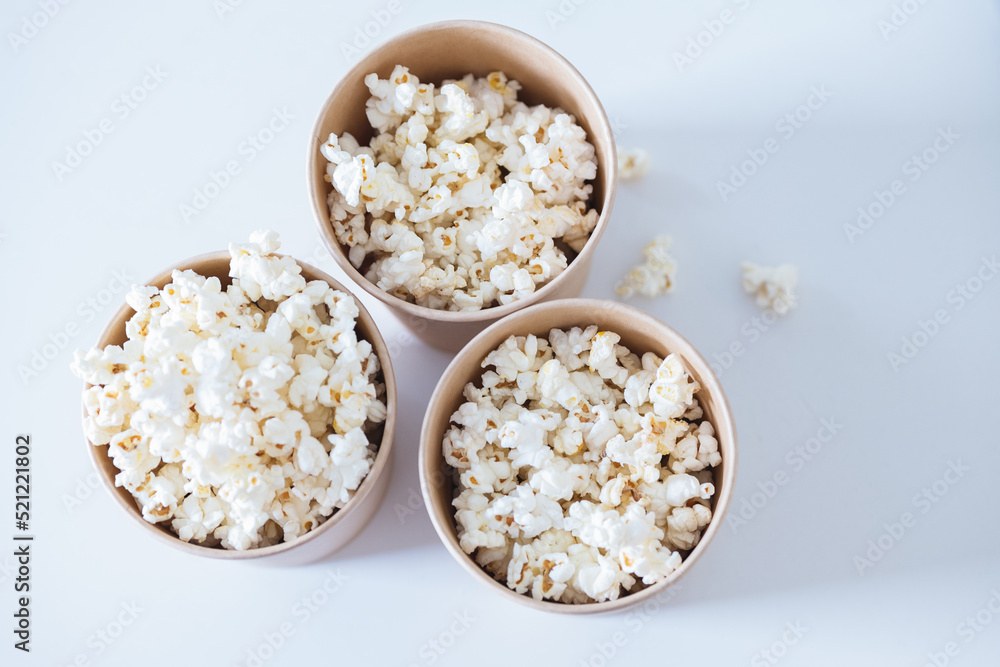 Buckets with popcorn on table Buckets with popcorn on table