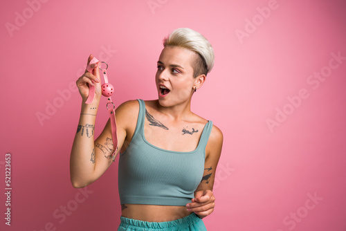 Photos Seductive girl looking at the mouth bdsm gag toy for playing pervert fetish game