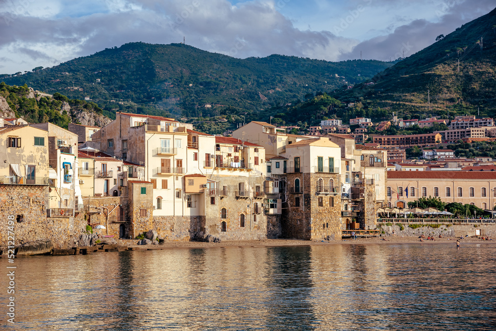 Traditional Italian houses on the seaside in Cefalu Village in the summertime - Europe