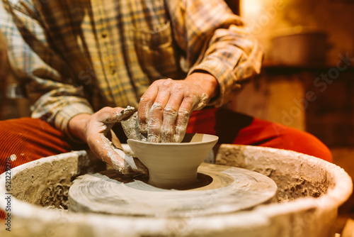 pottery in workshop of ceramist