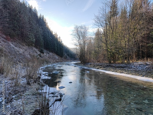 Picturesque river during wintertime in Zazriva, Slovakia photo