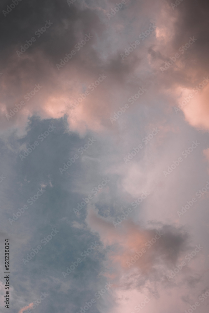 Pink sunset sky with clouds at evening