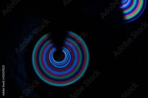 Time-lapse photograph of an uncompleted circle with multicolor light. photo