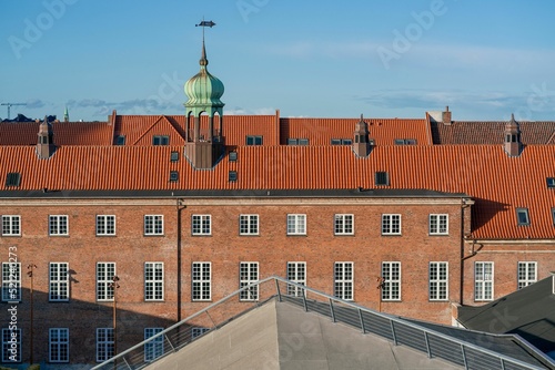 Photography Building in Copenhagen with a red rooftop and brick wall on a sunny day