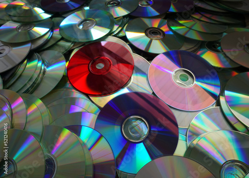 Piles of CDs in Various Colors (Background) photo