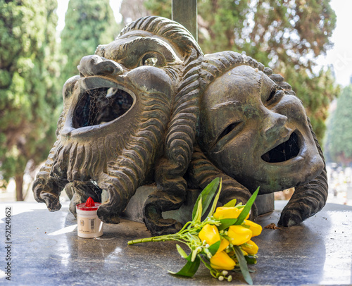 A pair of masks on the tomb of the Genoese actor of comedy Gilberto Govi, founder of the Genoese dialect theater in the monumental cemetry of Genoa, Italy.