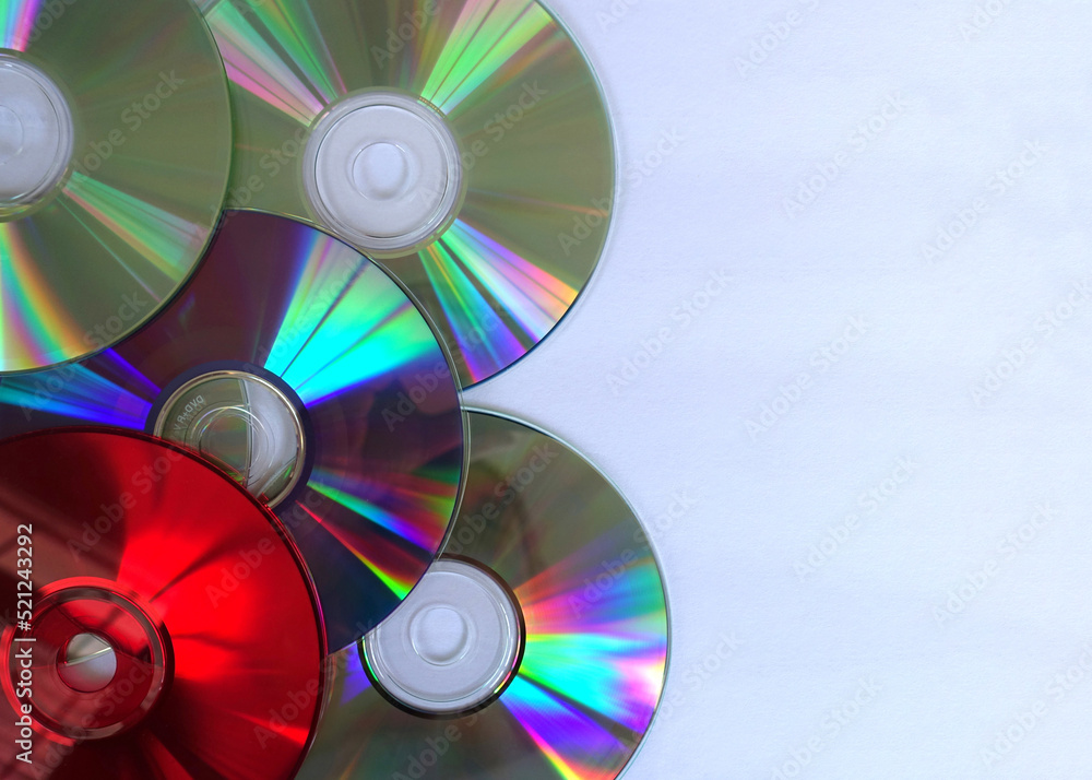 Colorful CDs against a White Background with Empty Copy Space Colorful CDs against a White Background with Empty Copy Space