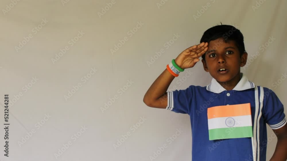 little indian boy proudly holding Tricolour Indian National flag. Stock
