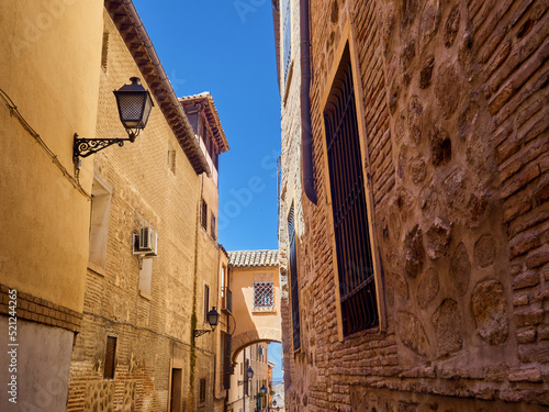 Arch in Angel street, a charming narrow street in Toledo, Castilla La Mancha, Spain photo