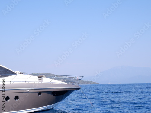 Yacht moored at sea , front view . Selected focus is yacht, sea and sky. Vacation concept.