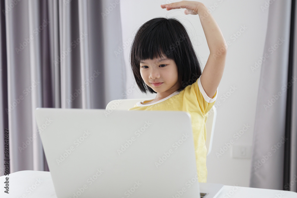 little asian girl student study online using laptop computer at home little asian girl student study online using laptop computer at home
