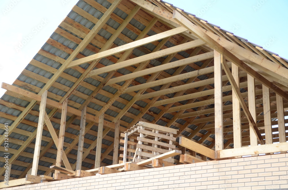 Construction of a brick and wooden roof house construction in progress Construction of a brick and wooden roof house construction in progress