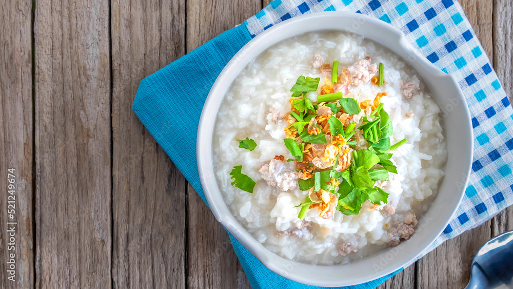 Breakfast rice porridge on a wooden table Breakfast rice porridge on a wooden table