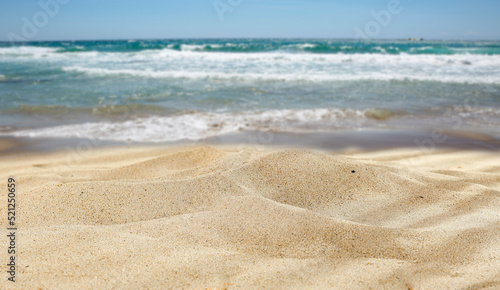Free place in the sand on the beach, on the seashore on a beautiful holiday day