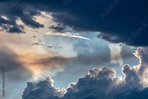Fotografie, Tablou Thunder clouds merging prior to dramatic lightning storm at sunset