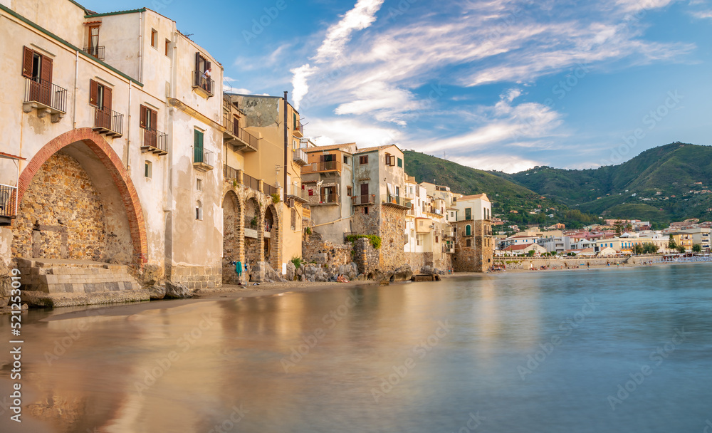 The coastline of Cefalu town on the sea wateredge in the summertime in Italy, Sicily island, Europe