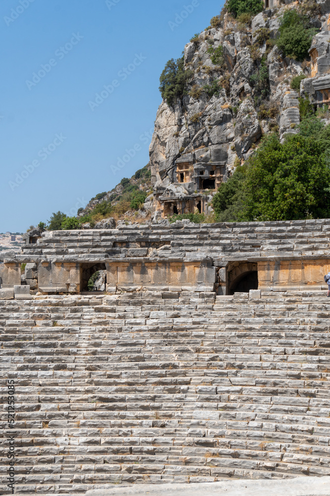 View of the amphitheater of the ancient city of Myra, on a sunny day. View of the amphitheater of the ancient city of Myra, on a sunny day.