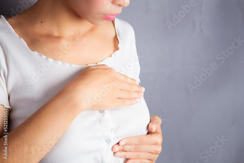 (Cyclical breast pain) A woman with pain related to menstruation. caused due to changes in hormone levels in the body