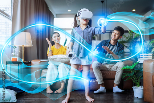 Принти на полотні exiting asian child female enjoy metaverse gaming with wearable vr headset with