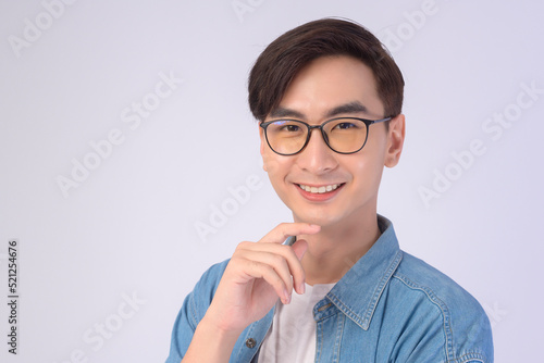 Portrait of asian man wearing glasses over white background studio, eyecare concept..