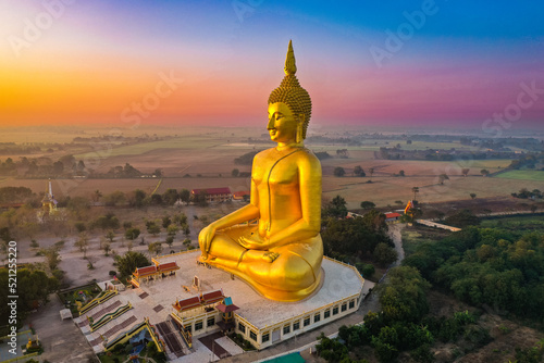 Big Buddha during sunset at Wat Muang in Ang Thong, Thailand photo