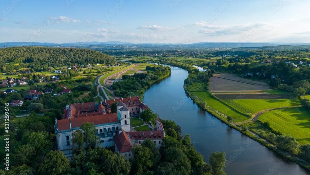 Obraz premium Aerial view of Benedictine Abbey on the rocky hill and Vistula River in Tyniec, near Krakow, Poland 