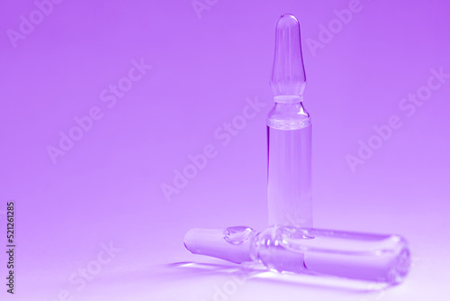 Glass medical ampoules for injection.  Ampoules with vaccine, medicine, collagen, vitamins © Ruslan