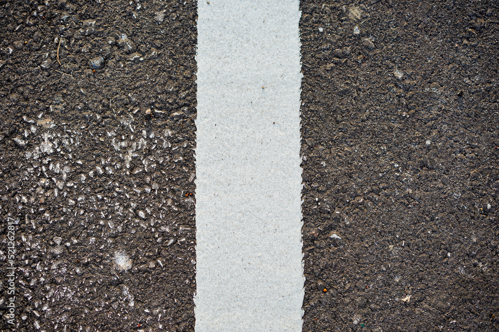 Fototapeta premium New asphalt road surface with white line