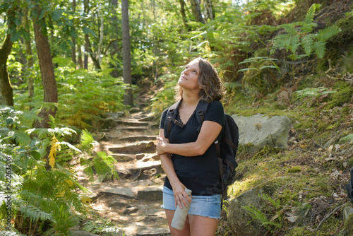 caucasian woman hiking in french forest