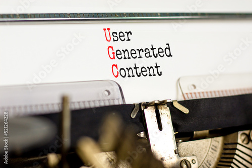 UGC user generated content symbol. Concept words UGC user generated content typed on the old retro typewriter on a beautiful white background. Business UGC user generated content concept. Copy space. photo