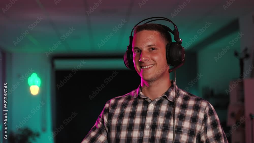 Overjoyed man winning videogame having fun, celebrating victory at home.
Overjoyed man winning videogame having fun, celebrating victory at home.