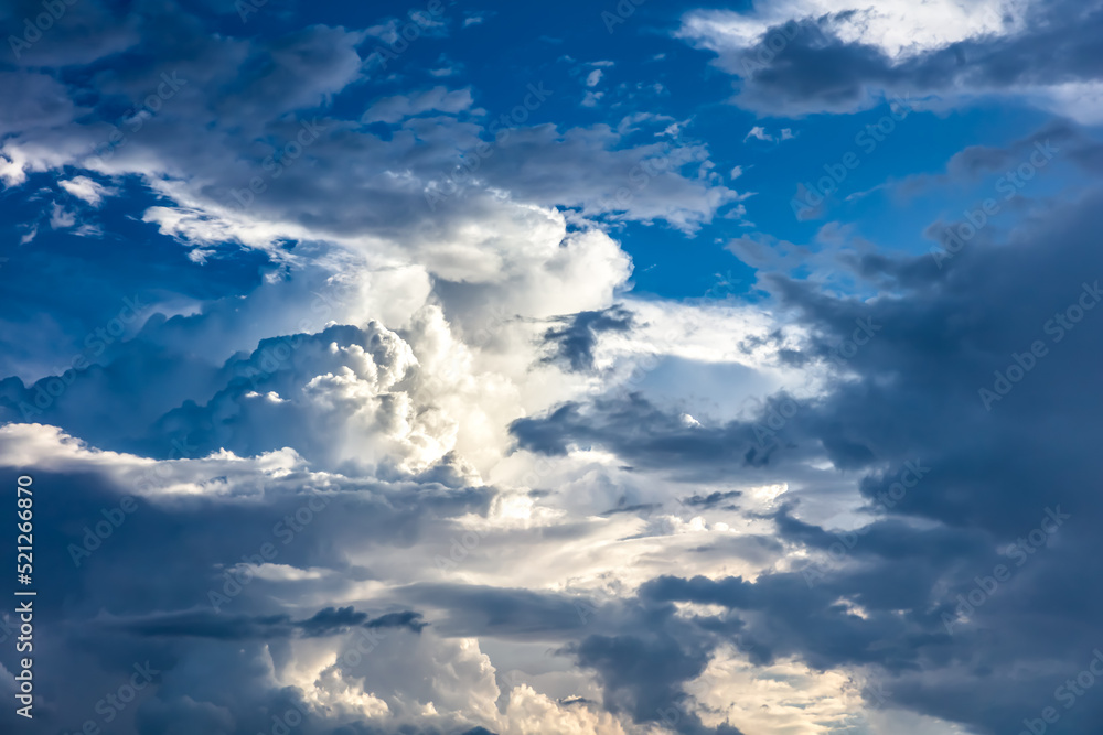 Fototapeta premium Closeup of Billowy cumulus clouds. Wispy clouds, deep blue sky in background. 