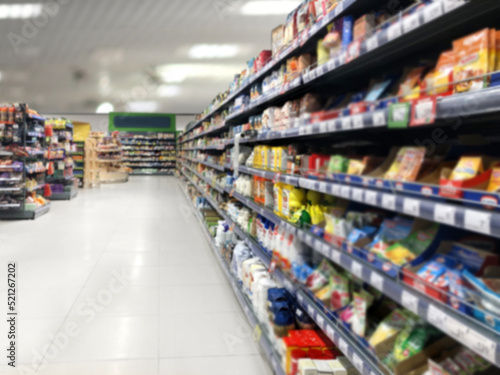 Choosing a dairy products at supermarket.Grocery stores .blurred background © lado2016