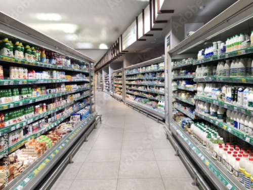 Choosing a dairy products at supermarket.Grocery stores .blurred background