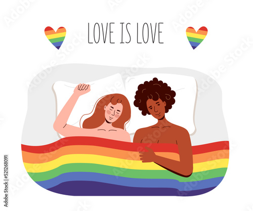 Lesbian women lie under the rainbow flag of lgbt. Girls are engaged in interracial free sex