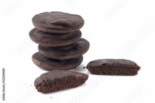 Chocolate cookies with jelly isolated on bright background. Crumbs of cake. Close up view.