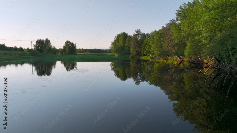 Aerial view of a river crossing the countryside at sunset in Overtornea, Sweden. Aerial view of a river crossing the countryside at sunset in Overtornea, Sweden.
