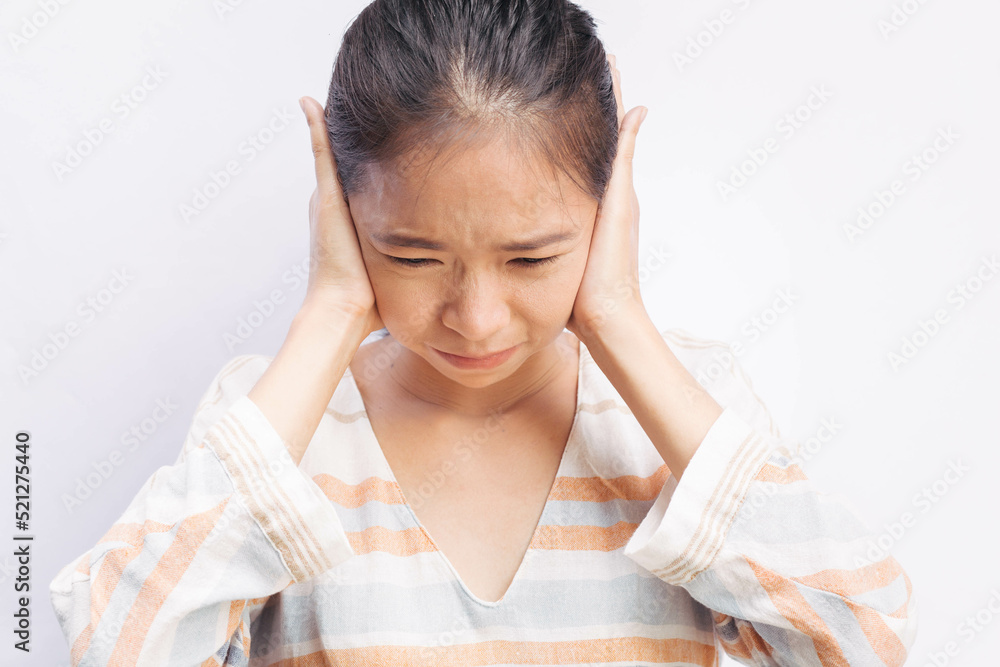 Asian woman suffering from earache. Symptoms of acute external otitis media. Health care concept. Asian woman suffering from earache. Symptoms of acute external otitis media. Health care concept.