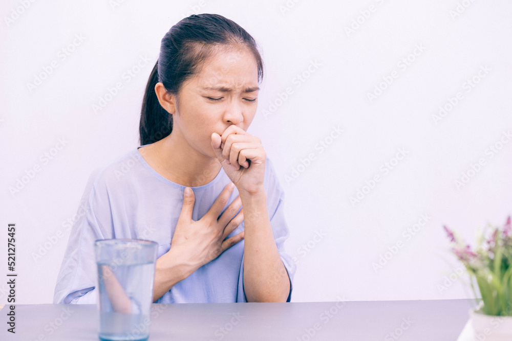 The girl coughs and sneezes. Treating sickness at home. The girl coughs and sneezes. Treating sickness at home.