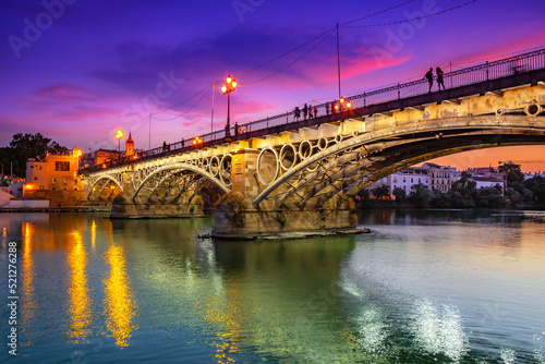 Views of Seville city, with Guadalquivir river and bridges, towers, streets and Squares in Spain. © gatsi