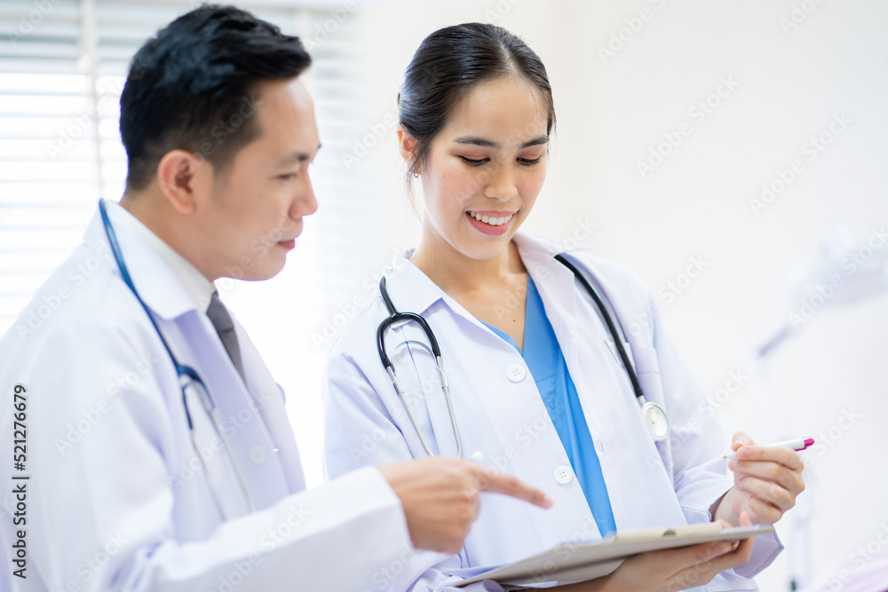Two doctors consulted the patient's case at the hospital., Hospital and Medical concept. Two doctors consulted the patient's case at the hospital., Hospital and Medical concept.