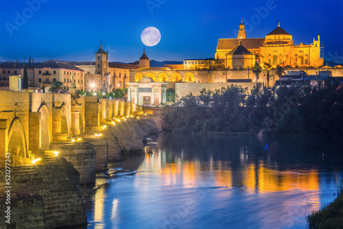 Cordoba, Spain. Roman Bridge on Guadalquivir river and The Great Mosque (Mezquita Cathedral) in the city of Cordoba, Andalusia. photo