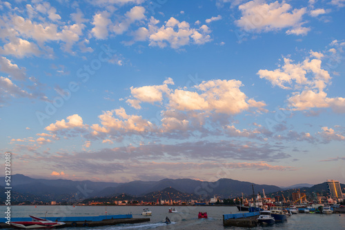 Canvastavla Beautiful sunset and small ships in Batumi sea port