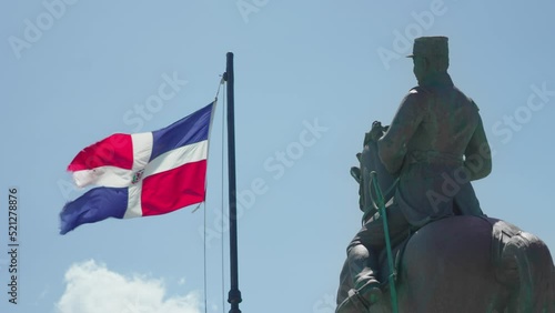 Dominican Republic flag and statue of General Gregorio Luperon in the Dominican Republic