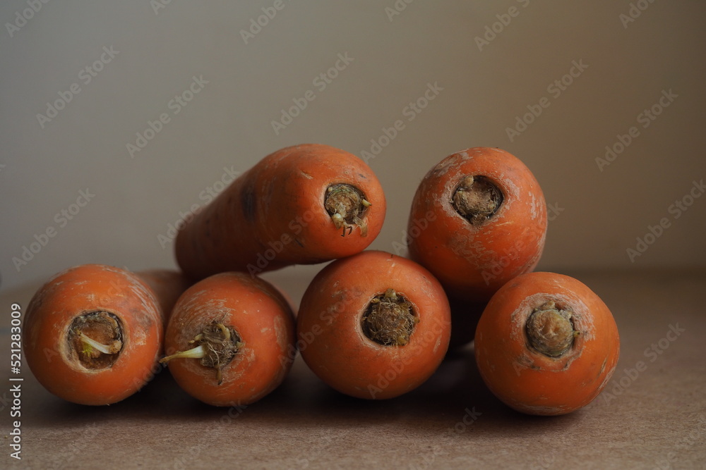 Carrot on a beige background. Rural style Carrot on a beige background. Rural style