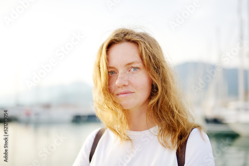 Fotografie Portrait of charming young tourist woman on the Mediterranean coast