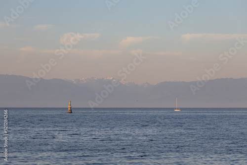 Sailboat silhouetted against the Olympic Mountains of Washington © Paul Van Buekenhout